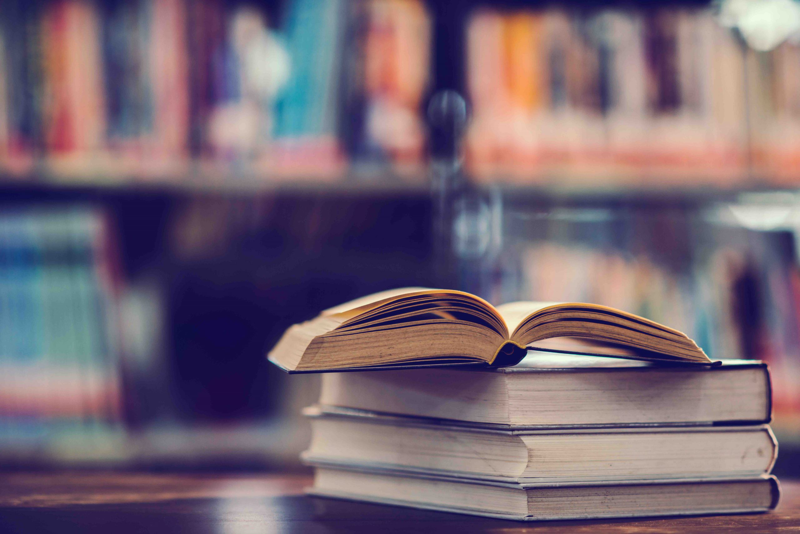 Book in library with open textbook,education learning concept